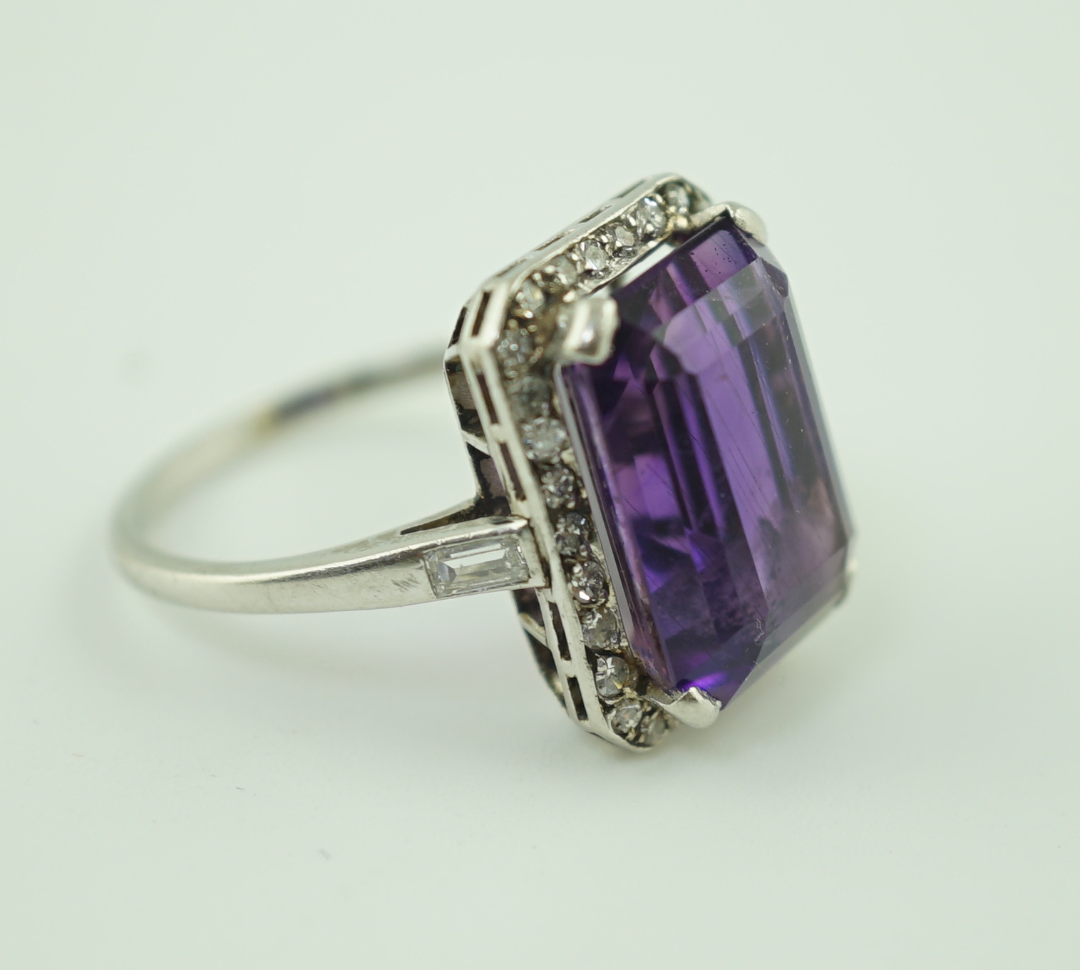 A mid 20th century platinum?, amethyst and diamond set cluster ring